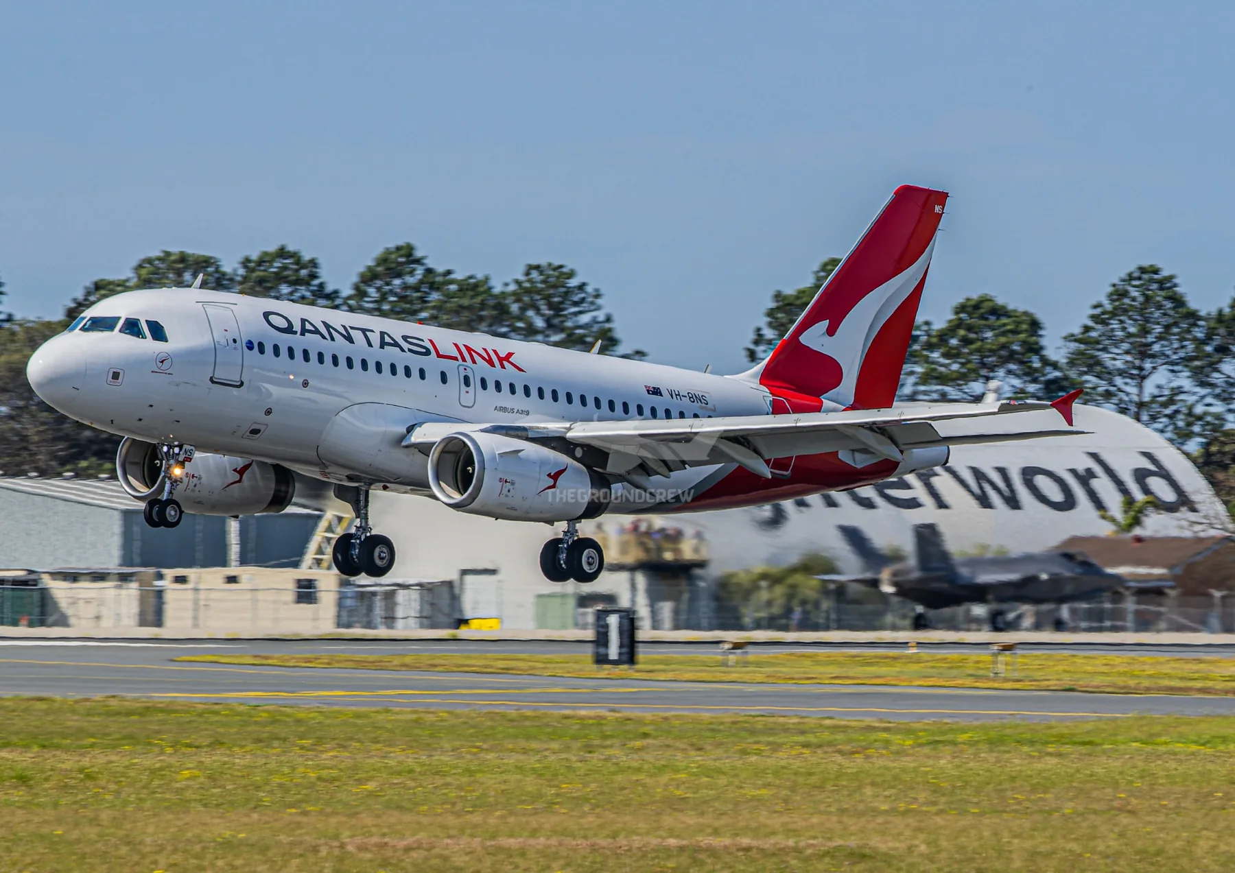 QantasLink Airbus A319 landing at Newcastle Williamtown
